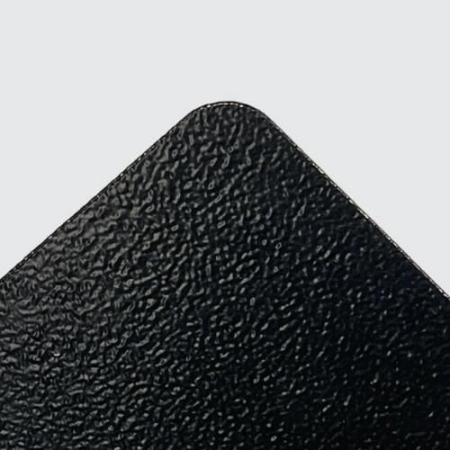 Close-up of black powder-coated sheet metal surface with textured finish.